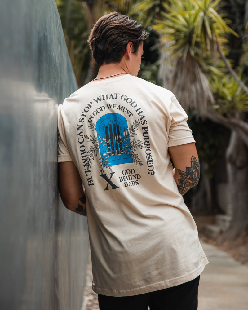 God Behind Bars "God's Purpose" Sand Tee Apparel In God We Must 