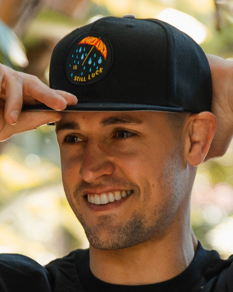 Hard Luck Snapback Hat In God We Must 
